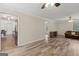 Open living room features hardwood floors and natural light flowing into the room at 147 Pine St, Covington, GA 30014