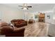 Spacious living room featuring comfortable sofas, fireplace, and hardwood floors at 147 Pine St, Covington, GA 30014