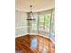 Bright dining area featuring hardwood floors, wainscoting, and large windows offering great views at 398 Mckenzie Dr, Stockbridge, GA 30281