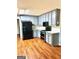 Stylish kitchen features stainless steel appliances, gray cabinetry and a beautiful stone backsplash at 398 Mckenzie Dr, Stockbridge, GA 30281