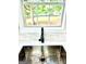 Close-up of a stainless steel sink with stone backsplash at 398 Mckenzie Dr, Stockbridge, GA 30281