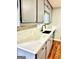 Kitchen featuring gray cabinetry, stone backsplash, white counters and modern appliances at 398 Mckenzie Dr, Stockbridge, GA 30281
