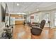 Spacious finished basement with hardwood floors, kitchenette, and comfortable seating area at 100 Old Plantation Way, Fayetteville, GA 30214