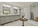 Luxurious bathroom with double sinks, walk-in shower and decorative accents at 100 Old Plantation Way, Fayetteville, GA 30214