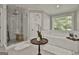 Beautiful bathroom featuring a glass shower and a separate soaking tub at 100 Old Plantation Way, Fayetteville, GA 30214