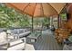 Spacious covered deck with fireplace, grill and comfortable seating, perfect for entertaining outdoors at 100 Old Plantation Way, Fayetteville, GA 30214