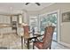 Sunlit dining area off the kitchen with backyard access and open flow concept, perfect for entertaining at 100 Old Plantation Way, Fayetteville, GA 30214