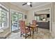 Bright dining area with tile floors and sliding doors to the deck for easy indoor/outdoor dining at 100 Old Plantation Way, Fayetteville, GA 30214