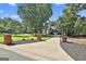 Long driveway leading to a charming home surrounded by mature trees at 100 Old Plantation Way, Fayetteville, GA 30214