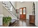 Elegant foyer featuring hardwood floors, stairs and an entry door with glass at 100 Old Plantation Way, Fayetteville, GA 30214