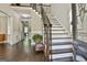 Elegant foyer with hardwood floors, staircase, and views of the living spaces at 100 Old Plantation Way, Fayetteville, GA 30214