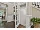 Charming hallway with hardwood floors, glass doors, and decorative molding providing seamless transitions at 100 Old Plantation Way, Fayetteville, GA 30214