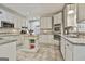 Expansive kitchen featuring stainless steel appliances, a central island, and abundant storage throughout at 100 Old Plantation Way, Fayetteville, GA 30214