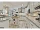 Spacious kitchen with white cabinetry, granite countertops, stainless steel appliances, and a central island at 100 Old Plantation Way, Fayetteville, GA 30214