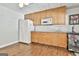 Convenient kitchenette with granite countertops, refrigerator, and ample cabinet space at 100 Old Plantation Way, Fayetteville, GA 30214