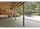 Covered patio area with comfortable seating and access to the pool area at 100 Old Plantation Way, Fayetteville, GA 30214