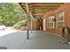 Spacious patio with brick accents and access to the backyard at 100 Old Plantation Way, Fayetteville, GA 30214