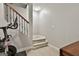 Staircase leading to the basement with gym equipment, offering space for exercise and storage at 100 Old Plantation Way, Fayetteville, GA 30214
