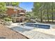Spacious swimming pool and deck with outdoor seating and lush landscaping in a serene backyard at 100 Old Plantation Way, Fayetteville, GA 30214