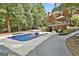 Backyard pool with diving board and outdoor seating, perfect for entertaining and summer fun at 100 Old Plantation Way, Fayetteville, GA 30214