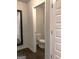 Neutral powder room featuring modern fixtures, paint, and wood-look floors at 85 Crabapple Ridge Dr, Oxford, GA 30054