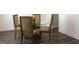 Dining room featuring a glass table and four ornate chairs at 85 Crabapple Ridge Dr, Oxford, GA 30054