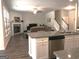 Spacious living room with hardwood floors, a stone fireplace, and plenty of natural light at 85 Crabapple Ridge Dr, Oxford, GA 30054