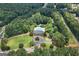 A high angle of community pool and clubhouse and surrounding trees at 48 Star Spangled Ln, Peachtree City, GA 30269