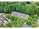 An aerial view of townhomes with mature green trees and well maintained landscaping at 48 Star Spangled Ln, Peachtree City, GA 30269