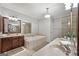 Bright bathroom featuring a soaking tub, double vanity, tile flooring, and neutral paint at 48 Star Spangled Ln, Peachtree City, GA 30269