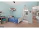 Brightly painted bedroom with a view into a bathroom and playful decor at 48 Star Spangled Ln, Peachtree City, GA 30269
