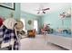Brightly painted bedroom with a ceiling fan and playful decor at 48 Star Spangled Ln, Peachtree City, GA 30269