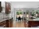 Open-concept kitchen and dining area with granite countertops and access to the backyard at 48 Star Spangled Ln, Peachtree City, GA 30269