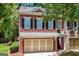 Charming two-story brick townhome with a two-car garage and beautifully landscaped front yard at 48 Star Spangled Ln, Peachtree City, GA 30269