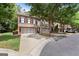 View of townhomes with landscaped yards, garages and attractive street appeal at 48 Star Spangled Ln, Peachtree City, GA 30269
