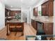Spacious kitchen with wood cabinets, hardwood floors, and large center island with seating at 48 Star Spangled Ln, Peachtree City, GA 30269