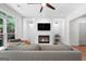 Modern living room featuring a fireplace, hardwood floors and contemporary decor at 48 Star Spangled Ln, Peachtree City, GA 30269