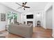 Contemporary living room with hardwood floors, modern fireplace, and bright natural light at 48 Star Spangled Ln, Peachtree City, GA 30269