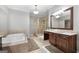 Main bathroom features a soaking tub, glass-enclosed shower, and double sink vanity at 48 Star Spangled Ln, Peachtree City, GA 30269