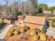 Beautiful landscaped yard with healthy shrubs and brick wall with gate, providing privacy and curb appeal at 200 Magnolia Ct, Mcdonough, GA 30252