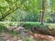 Scenic creek view surrounded by mature trees and lush greenery, offering a serene outdoor space at 95 Fern Ct, Stockbridge, GA 30281