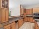 Traditional kitchen with wood cabinets, stainless steel appliances, and neutral countertops at 95 Fern Ct, Stockbridge, GA 30281