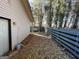 A fenced backyard with leaf cover, a white swing, and partial sun exposure at 7560 Taylor Rd # 5, Riverdale, GA 30274