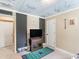 Bedroom with a TV, carpeted floors, and sports-themed decor at 2110 Mcgarity Rd, Mcdonough, GA 30252