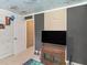 Bedroom featuring a TV, brick wall, and sports-themed rug at 2110 Mcgarity Rd, Mcdonough, GA 30252