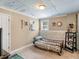 Cozy bedroom featuring unique brick accents and decorative wall art at 2110 Mcgarity Rd, Mcdonough, GA 30252