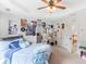 Cozy bedroom featuring a ceiling fan, study space, and view to the hall at 2110 Mcgarity Rd, Mcdonough, GA 30252