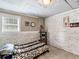 View of a carpeted bedroom with a bed, side table, and a window at 2110 Mcgarity Rd, Mcdonough, GA 30252