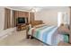 Cozy bedroom with wood furniture, a ceiling fan, and access to an ensuite bathroom at 2110 Mcgarity Rd, Mcdonough, GA 30252