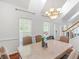 Bright dining room features beautiful table, hardwood floors, and natural light at 2110 Mcgarity Rd, Mcdonough, GA 30252